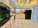 Updated kitchen showcasing light wood cabinetry, granite countertops, and modern appliances at 2341 Haitian Dr # 49, Clearwater, FL 33763