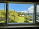 A lovely view of the community lawn and landscaping from the window provides a relaxing and scenic backdrop at 2341 Haitian Dr # 49, Clearwater, FL 33763