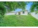 Backyard with a well-kept lawn, ideal for outdoor activities and gatherings with friends at 247 Winthrop Dr, Spring Hill, FL 34609