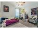 This bedroom is carpeted and features a playful decor with blue accents and ample lighting at 247 Winthrop Dr, Spring Hill, FL 34609