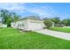 This home offers a well-maintained lawn and an attached two-car garage at 247 Winthrop Dr, Spring Hill, FL 34609
