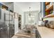 Bright eat-in kitchen features stainless steel appliances, wood floor and an adjacent laundry closet at 247 Winthrop Dr, Spring Hill, FL 34609