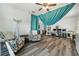 Spacious living room featuring wood floors, home office, and comfortable seating arrangements at 247 Winthrop Dr, Spring Hill, FL 34609