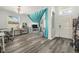 This living room features hardwood floors, a large window, and an open floor plan at 247 Winthrop Dr, Spring Hill, FL 34609