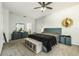 Spacious main bedroom features soft carpet, updated stylish furniture, and a ceiling fan at 247 Winthrop Dr, Spring Hill, FL 34609