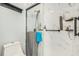 Stylish shower features a glass door, marble-style tiling, and a rainfall shower head at 247 Winthrop Dr, Spring Hill, FL 34609