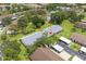 Aerial view of condo complex with well-manicured grounds, lush landscaping, and nearby parking at 2557 Laurelwood Dr # 10D, Clearwater, FL 33763