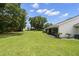 Expansive backyard with lush green lawn, landscaping, and ample space for outdoor activities at 2557 Laurelwood Dr # 10D, Clearwater, FL 33763