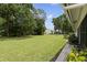 Expansive backyard with lush greenery, offering a private and serene outdoor space at 2557 Laurelwood Dr # 10D, Clearwater, FL 33763