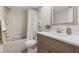 This bathroom has a shower/tub combo and updated vanity with neutral accents at 2557 Laurelwood Dr # 10D, Clearwater, FL 33763