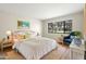 Comfortable bedroom with a large window overlooking the landscaped backyard at 2557 Laurelwood Dr # 10D, Clearwater, FL 33763