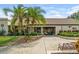 Inviting clubhouse exterior with lush landscaping, creating a welcoming community atmosphere at 2557 Laurelwood Dr # 10D, Clearwater, FL 33763