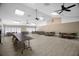 A large, well-lit gathering space with multiple tables and chairs provides a great place for activities at 2557 Laurelwood Dr # 10D, Clearwater, FL 33763