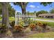 Charming community sign surrounded by colorful landscaping, creating a welcoming entrance at 2557 Laurelwood Dr # 10D, Clearwater, FL 33763
