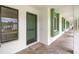Well-lit condo entrance showcasing a green door and tile flooring, flanked by green trim at 2557 Laurelwood Dr # 10D, Clearwater, FL 33763