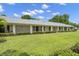 Well-maintained exterior of condo complex with manicured lawns and attractive landscaping at 2557 Laurelwood Dr # 10D, Clearwater, FL 33763