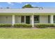 Close up of condo exterior featuring a well-kept lawn and building number at 2557 Laurelwood Dr # 10D, Clearwater, FL 33763
