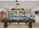 Bright game room with a billiard table and outside views offers a relaxing and fun space at 2557 Laurelwood Dr # 10D, Clearwater, FL 33763
