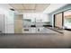 Well-maintained kitchen features white appliances, ample counter space, and a bright, functional design at 2557 Laurelwood Dr # 10D, Clearwater, FL 33763