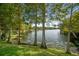Scenic lake view with lush green trees and a tranquil body of water at 2557 Laurelwood Dr # 10D, Clearwater, FL 33763