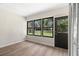 This empty lanai features a great view of the outdoors and access to the house at 2557 Laurelwood Dr # 10D, Clearwater, FL 33763