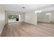 Spacious, bright living room with modern flooring and large sliding doors to the lanai at 2557 Laurelwood Dr # 10D, Clearwater, FL 33763