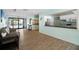 A bright lobby with views into the kitchen and a relaxing couch provides a welcome at 2557 Laurelwood Dr # 10D, Clearwater, FL 33763