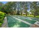Enjoy community shuffleboard courts surrounded by mature trees in a beautifully maintained setting at 2557 Laurelwood Dr # 10D, Clearwater, FL 33763