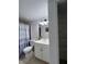Bathroom with a shower/tub, toilet, sink, and closet with shelving at 2850 Somerset Park Dr # 203, Tampa, FL 33613