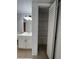 Bathroom vanity with ample storage space and a linen closet with shelving at 2850 Somerset Park Dr # 203, Tampa, FL 33613