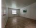Bedroom showcasing a window and tile floors at 2850 Somerset Park Dr # 203, Tampa, FL 33613
