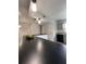 An open kitchen with white appliances and cabinets, a black counter top, and recessed lighting at 2850 Somerset Park Dr # 203, Tampa, FL 33613