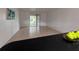 Bright living room features tile floors and sliding glass doors leading to a balcony at 2850 Somerset Park Dr # 203, Tampa, FL 33613