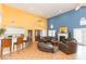 Bright and open community lounge with modern furniture and a cozy fireplace and kitchen area at 2850 Somerset Park Dr # 203, Tampa, FL 33613