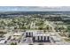 A sprawling aerial view shows a condo building surrounded by lush neighborhoods and water in the distance at 2901 W 26Th St # 301, Bradenton, FL 34205