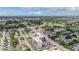 A wide aerial shot showcases a condo building among lush surroundings and a road in the distance at 2901 W 26Th St # 301, Bradenton, FL 34205