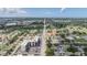 An aerial view of the condo building with landscaping and a long road in the distance at 2901 W 26Th St # 301, Bradenton, FL 34205