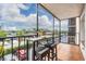 Cozy screened balcony with seating offers a pleasant outdoor retreat at 2901 W 26Th St # 301, Bradenton, FL 34205