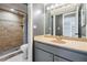 Bathroom with granite countertop vanity, gray walls, and tiled shower with a shower curtain at 2901 W 26Th St # 301, Bradenton, FL 34205
