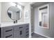 Updated bathroom with gray vanity, modern fixtures, and decorative mirror at 2901 W 26Th St # 301, Bradenton, FL 34205