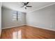 Bedroom featuring hardwood floors, a ceiling fan, and a window with blinds at 2901 W 26Th St # 301, Bradenton, FL 34205