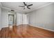 Bedroom with hardwood floors, a ceiling fan, closet, and neutral wall color at 2901 W 26Th St # 301, Bradenton, FL 34205