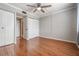 Cozy bedroom with wood-look flooring, ceiling fan, closet, and neutral paint at 2901 W 26Th St # 301, Bradenton, FL 34205
