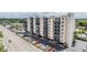 Exterior view of a condominium building surrounded by roads and parking spaces at 2901 W 26Th St # 301, Bradenton, FL 34205