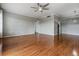 Comfortable living area with wood floors and neutral wall paint, flowing into the kitchen at 2901 W 26Th St # 301, Bradenton, FL 34205