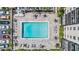 Aerial view of a sparkling community pool with ample seating and lush landscaping at 2901 W 26Th St # 301, Bradenton, FL 34205