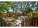 Landscaped backyard with a privacy fence at 301 Cevera Dr, Dunedin, FL 34698