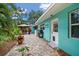 Charming backyard featuring a brick patio, grill, gazebo and garden at 301 Cevera Dr, Dunedin, FL 34698