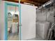 Cozy laundry room features a washer and dryer plus a bathroom with toilet and sink at 301 Cevera Dr, Dunedin, FL 34698