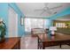 Bright living room with a ceiling fan, stylish decor, and comfortable seating at 301 Cevera Dr, Dunedin, FL 34698